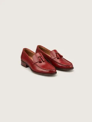 AI-generated product photo of the oxblood tassel loafers, one of the pieces in the Someone Shop.